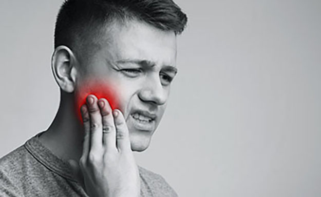 how to prevent tooth decay man holding cheek due to tooth pain, how to prevent tooth decay naturally