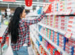woman looking for a toothpaste that her Specialty dentists suggets