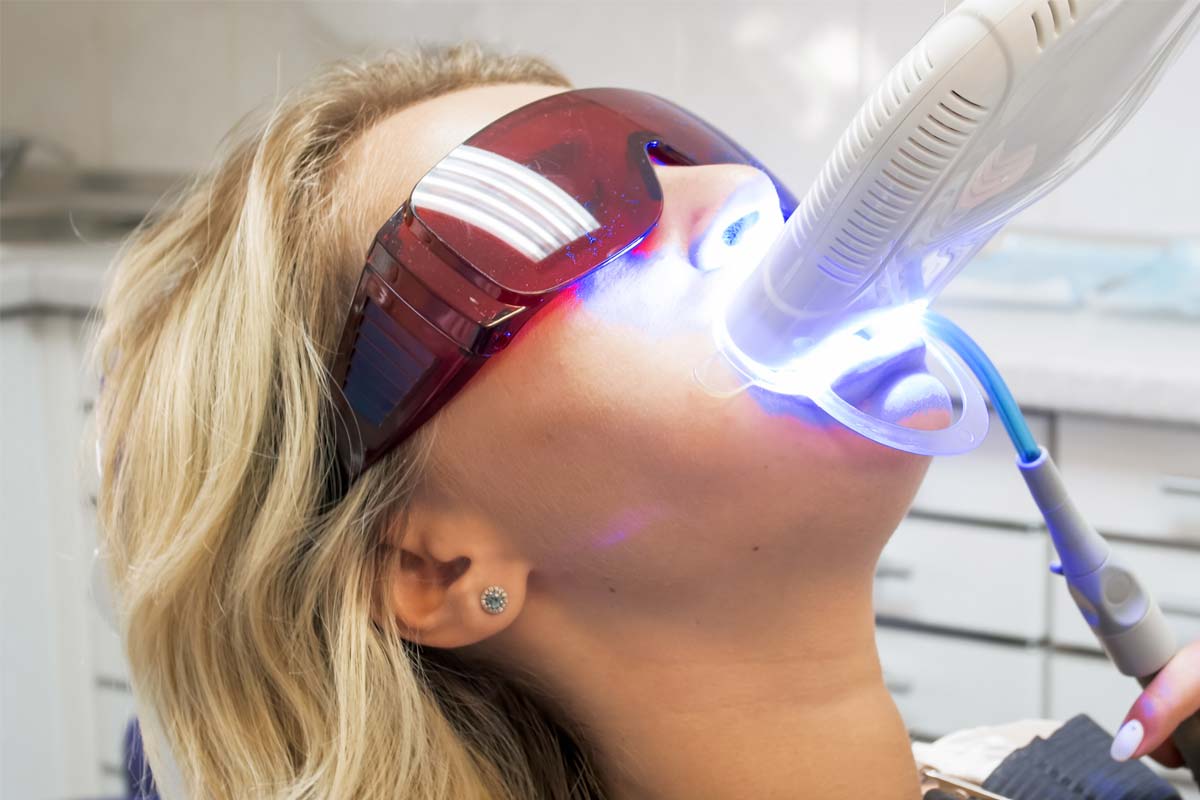 teeth-whitening-options woman looking into teeth whitening options