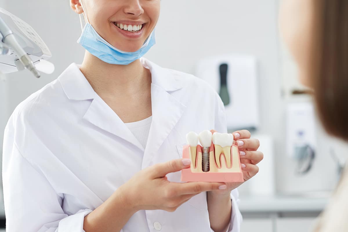 dentist showing dental implants
