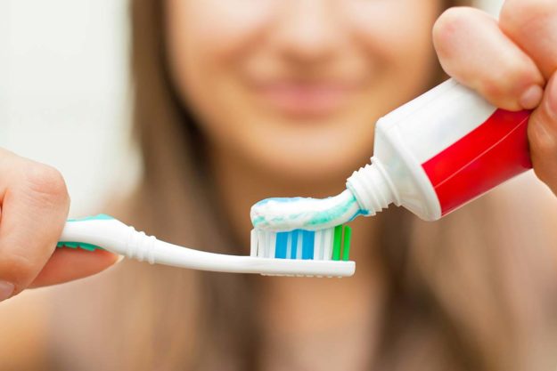toothbrush-safety-tips woman working on toothbrush safety tips