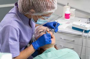 dentist helping a patient with periodontics