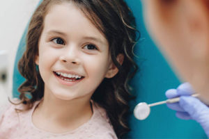 girl receiving pediatric dentistry services 