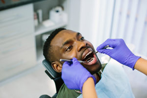 man learning about specialty dentistry services